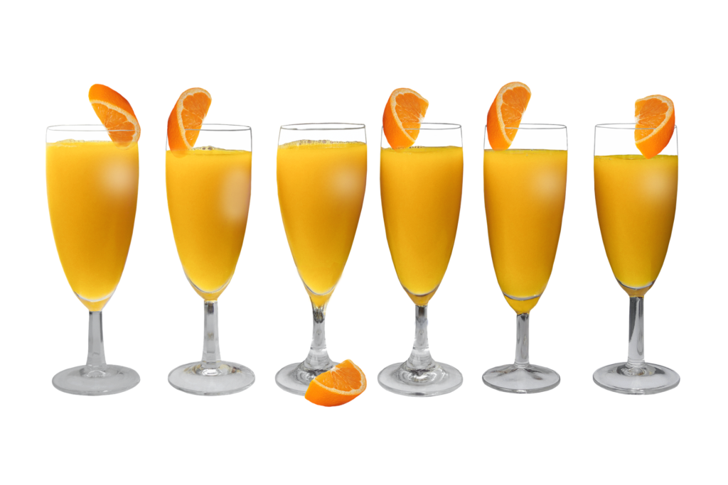 Line of six orange juice glasses with orange slices