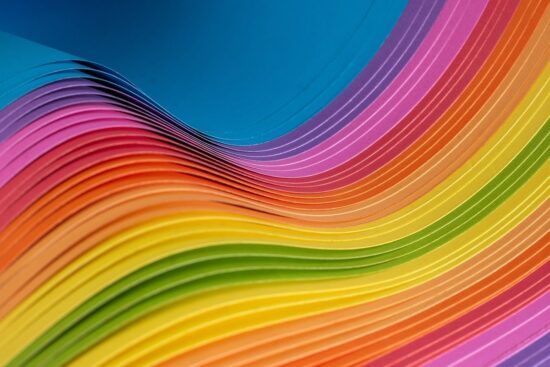 Waves of rainbow coloured paper representing variety