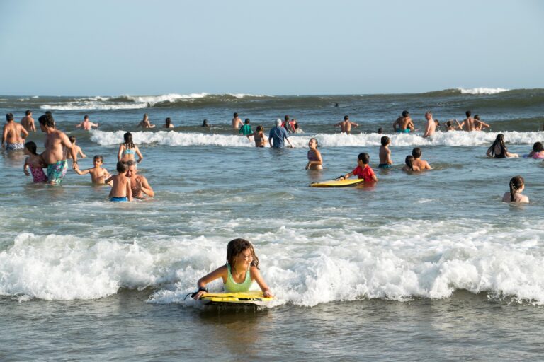 Family holidaying on the beach in the waves